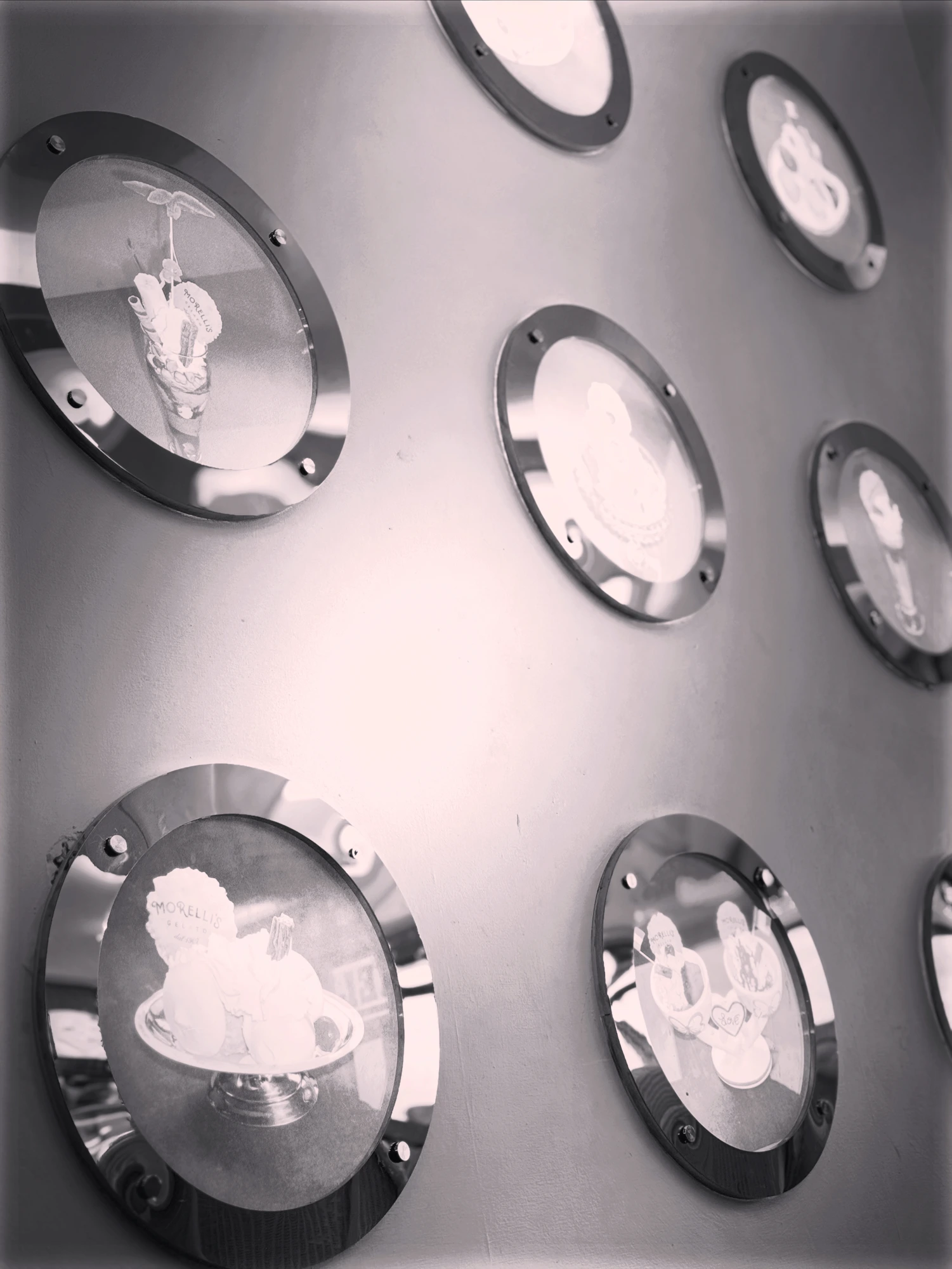 The parlour's vintage wall of etched glass dessert plates